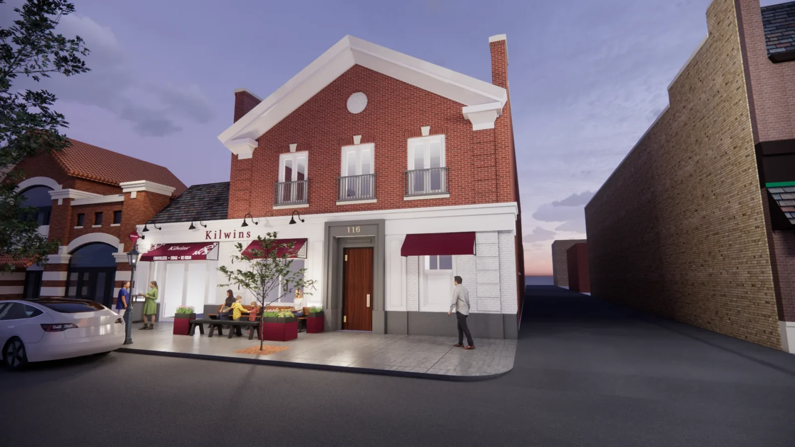 Rendering of the upgraded storefront at dusk, with gooseneck lights washing the white trim, a lit entry surround and outdoor seating on the sidewalk.