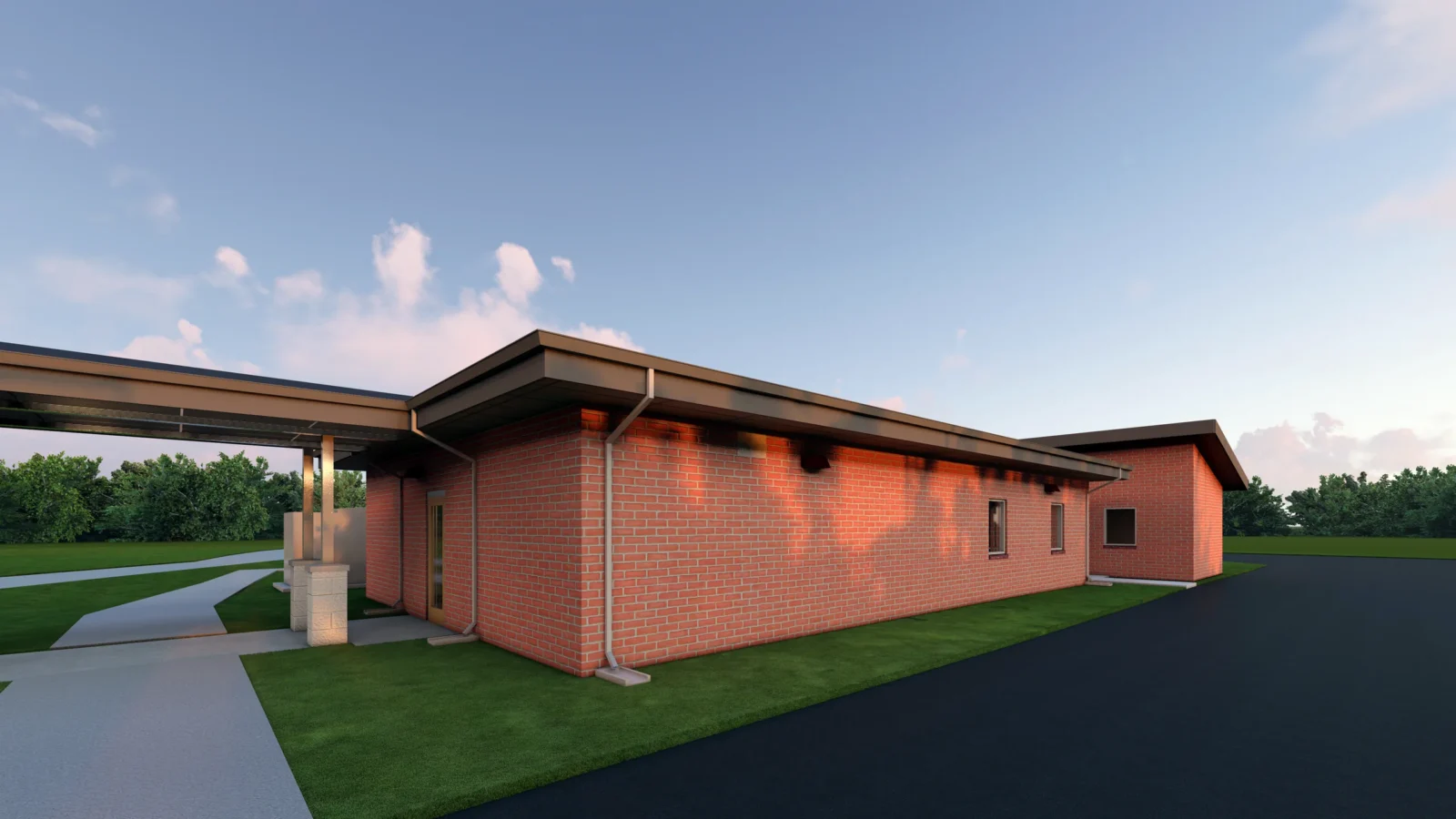 Rendering of the facility's red brick support wing at dusk, joined to the kennels by a covered walkway on cast-stone piers.